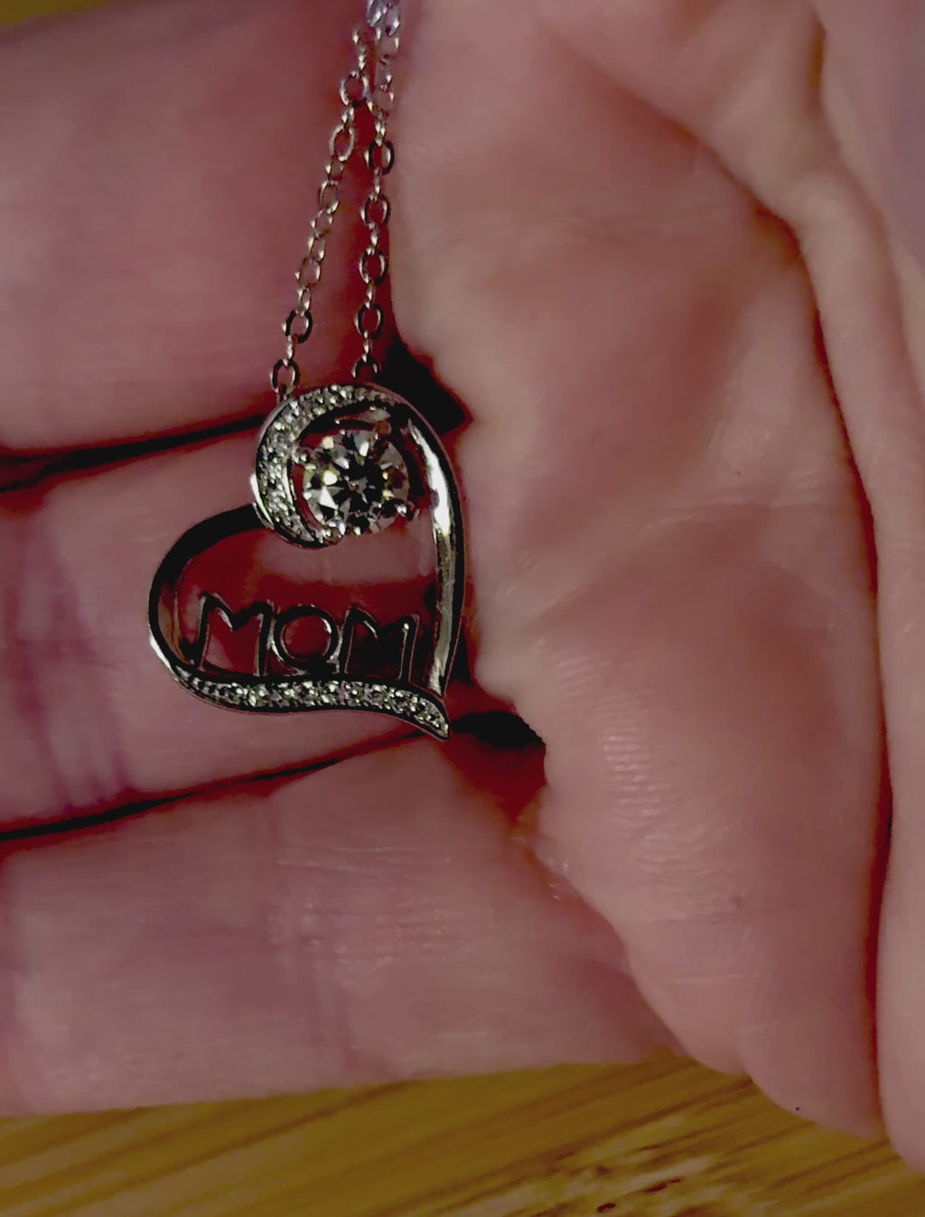 Moissanite necklace. A certified 1/2ct round radiant Moissanite in a pendant just for your mom or because you’re a mom, in sterling silver with zircon accents!