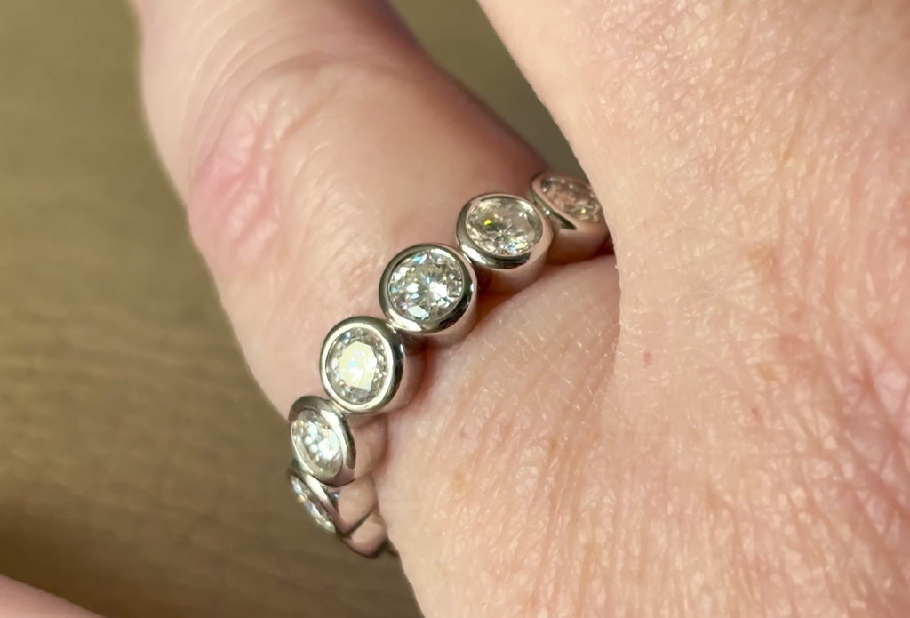 Moissanite ring. A certified, bezel-set eternity ring with 1/2ct round brilliant Moissanites set in a heavy, solid Argentium silver band!