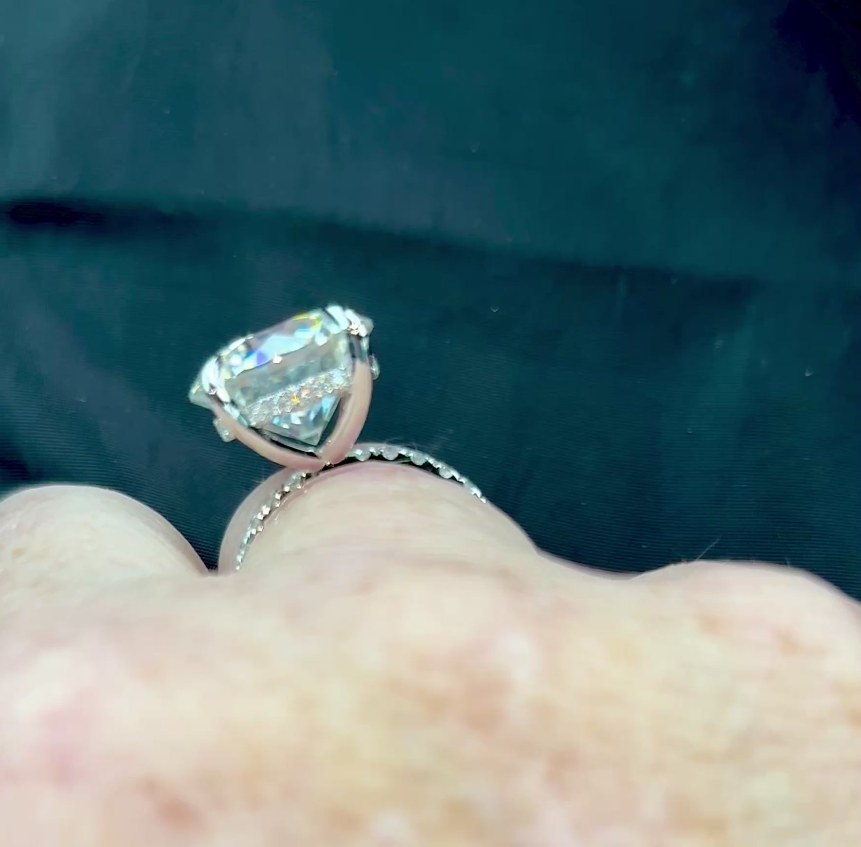 Moissanite solitaire. A glorious 10ct 8H8A Moissanite in a 4-prong mounting with a Moissanite “hidden halo” and shoulders, an 11.3cttw ring!