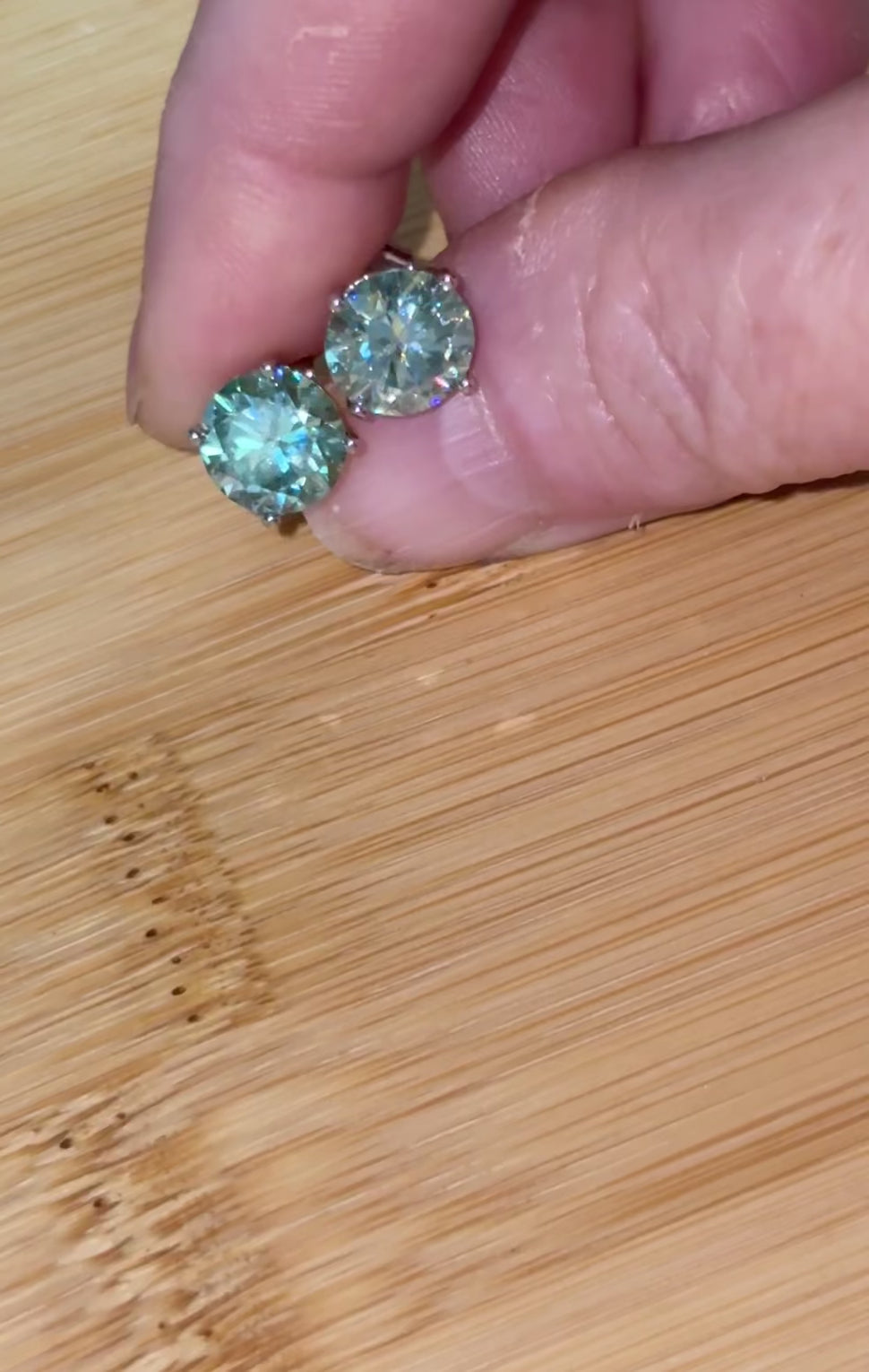 Moissanite earrings. A 6ctw certified pair of true icy baby blue Moissanite studs in sterling silver baskets with gleaming white rhodium!