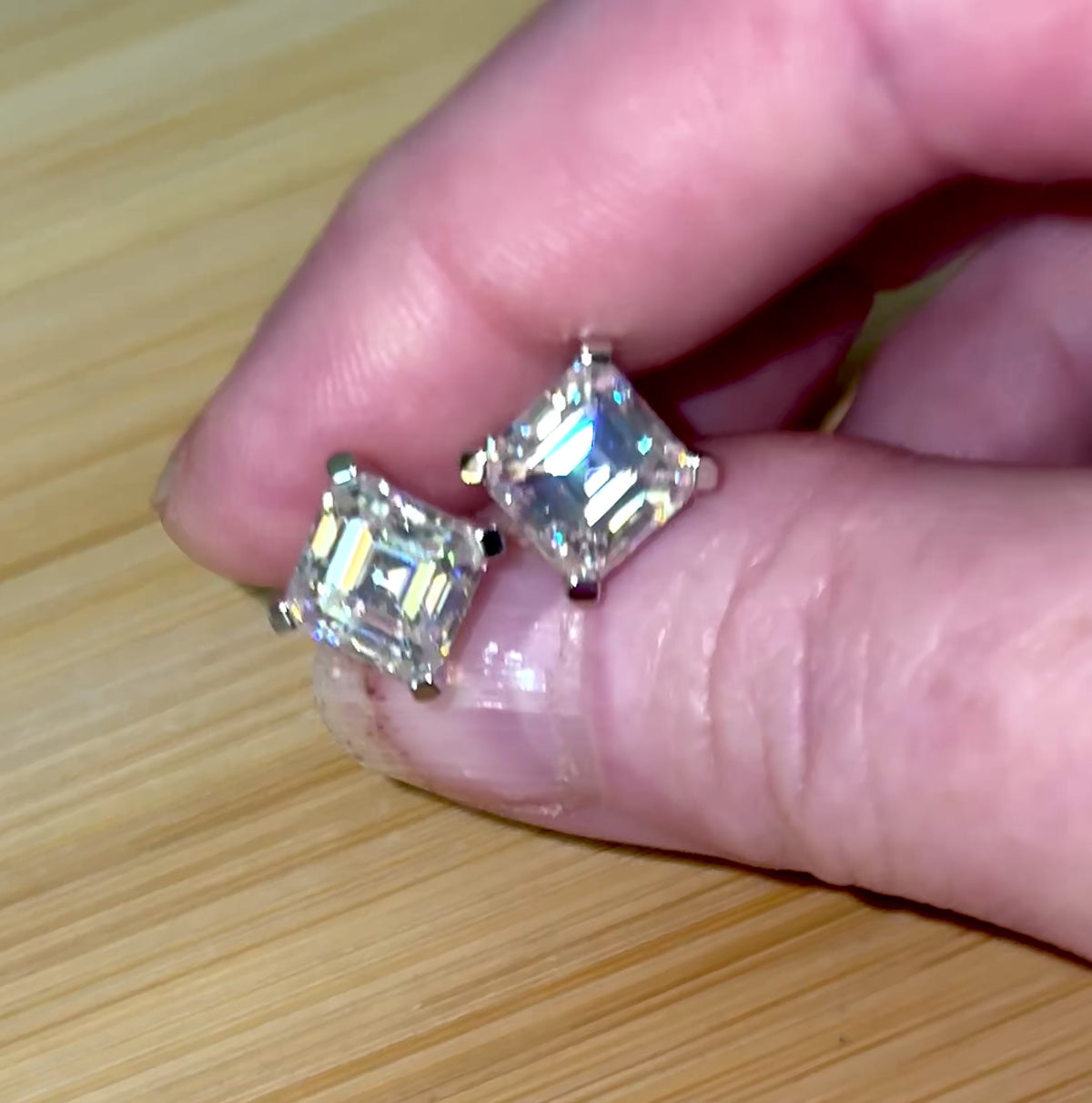 Moissanite studs. A 6.4ctw *perfect* pair of DOUBLE certified Asscher-cut Moissanites in my custom 4-claw 935 ARGENTIUM silver mountings! Opulent!