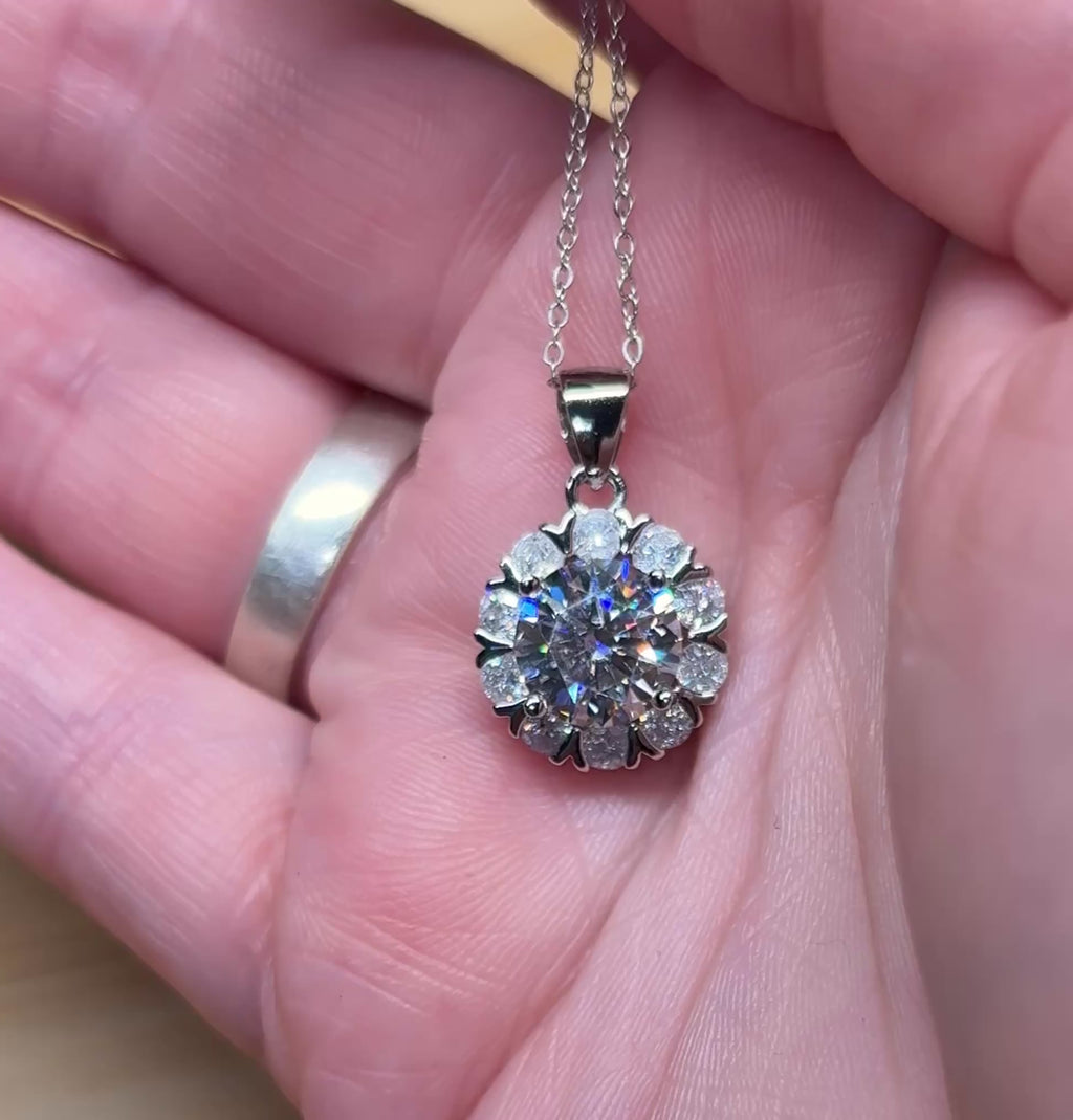 Moissanite necklace. A 3ct certified round brilliant Moissanite in a snowflake-shaped pendant ! A perfect piece for the holidays and beyond!