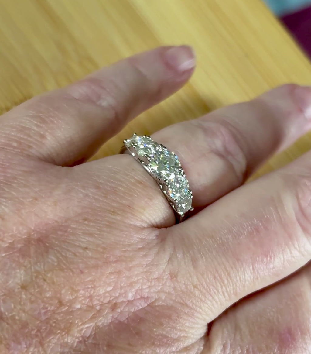 Moissanite ring. A 2.5ctw certified Moissanite ring, for those who want plenty of sparkle but a daintier ring! This feminine 5-stone design is just the thing!