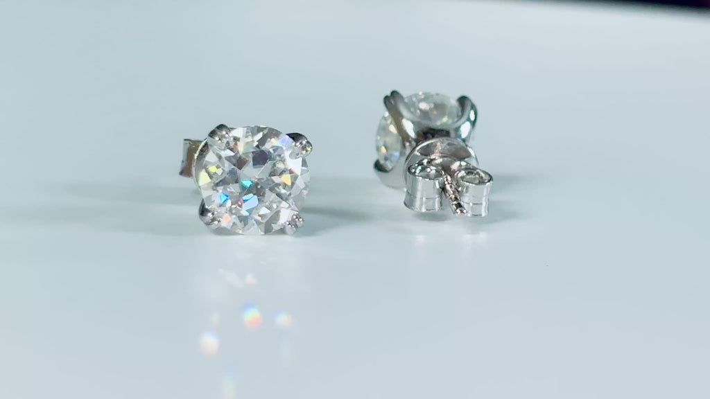 A lovely DOUBLE certified pair of 4cttw Old European Cut Moissanite studs in 935 Argentium silver and 18k double-claw mountings!