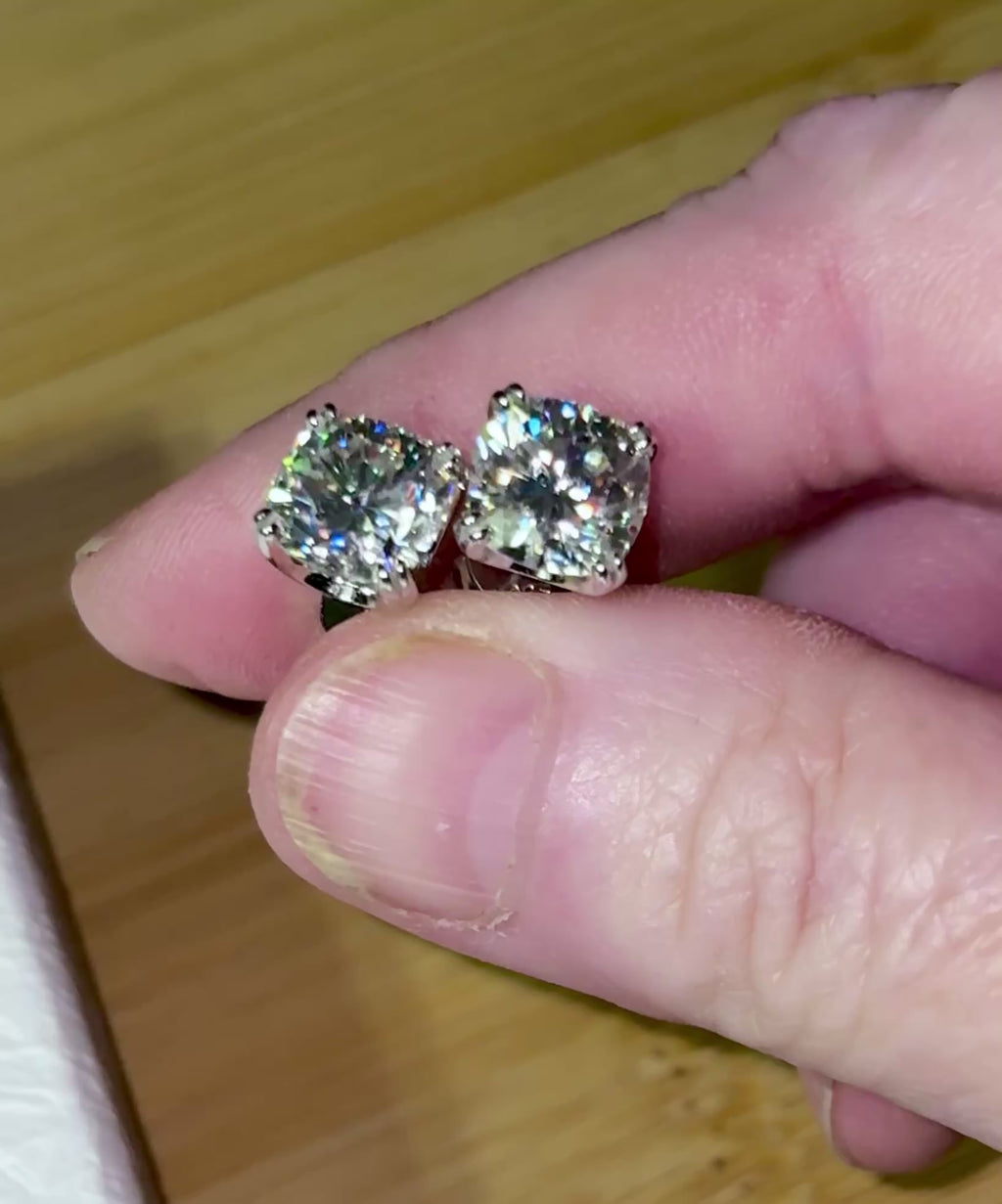 6ctw cushion-cut Moissanite studs in elegant sterling silver double-claw mountings! With brilliant faceting, these earrings are showstoppers!