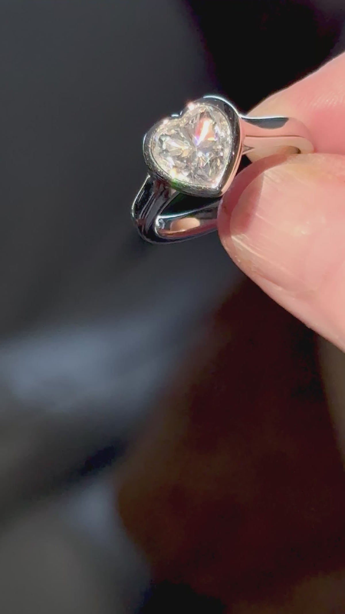 Moissanite ring. A high-end solitaire with a certified 3ct heart-cut stone, bezel-set in a heavy sterling silver mounting and bathed in 18k!
