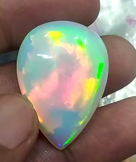 The “After the Storm” Ethiopian opal pendant, 39.18ct with rare “rolling” fire and spectacular play of color! **Collector’s grade** AAAA++