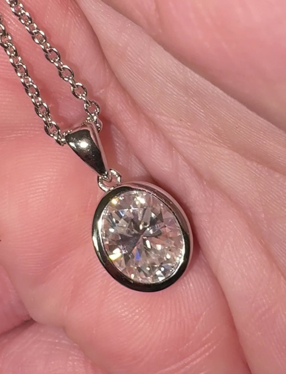 Moissanite solitaire necklace. A certified 5ct oval Moissanite in sterling silver and 18k!