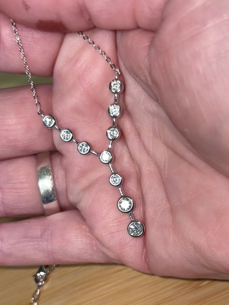 Moissanite neckpiece. A beautiful certified 1.4cttw Moissanite necklace featuring 10 round brilliants in a solid sterling bezel setting!