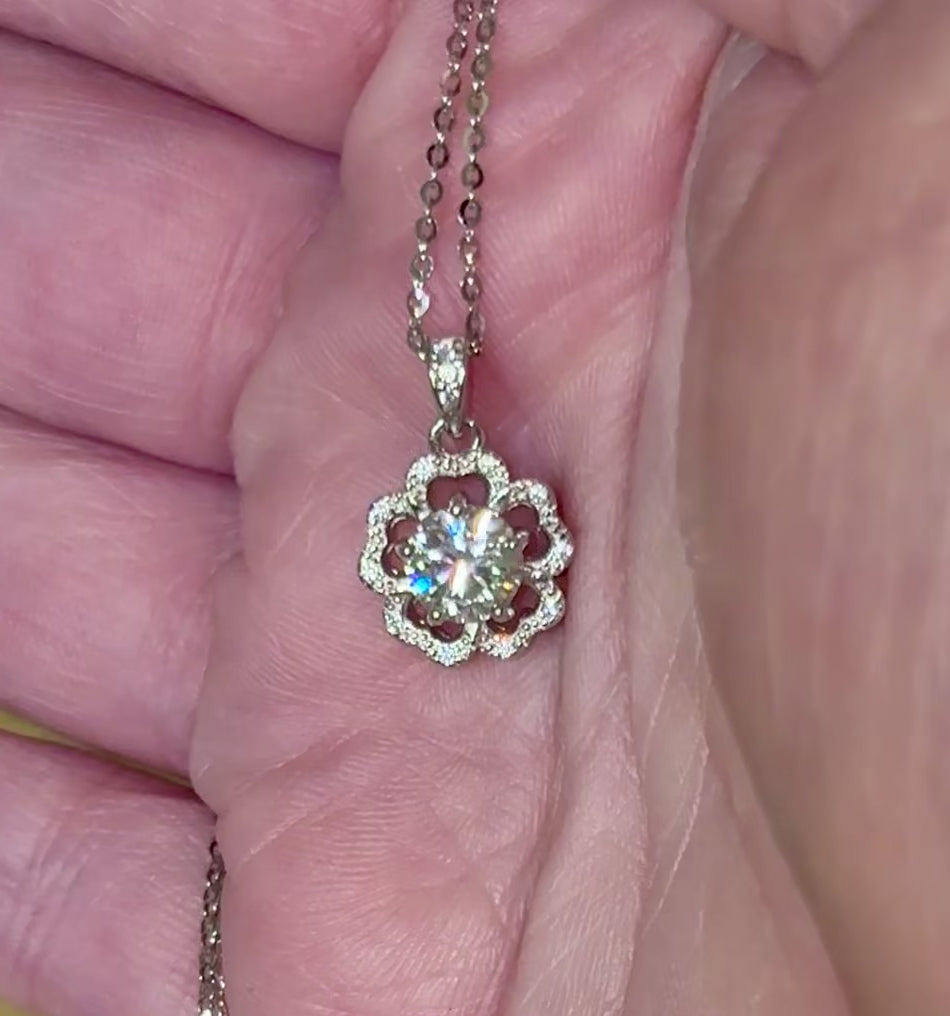 Moissanite necklace. A certified 1ct Moissanite hibiscus necklace with white zircon accents in solid sterling and white rhodium!