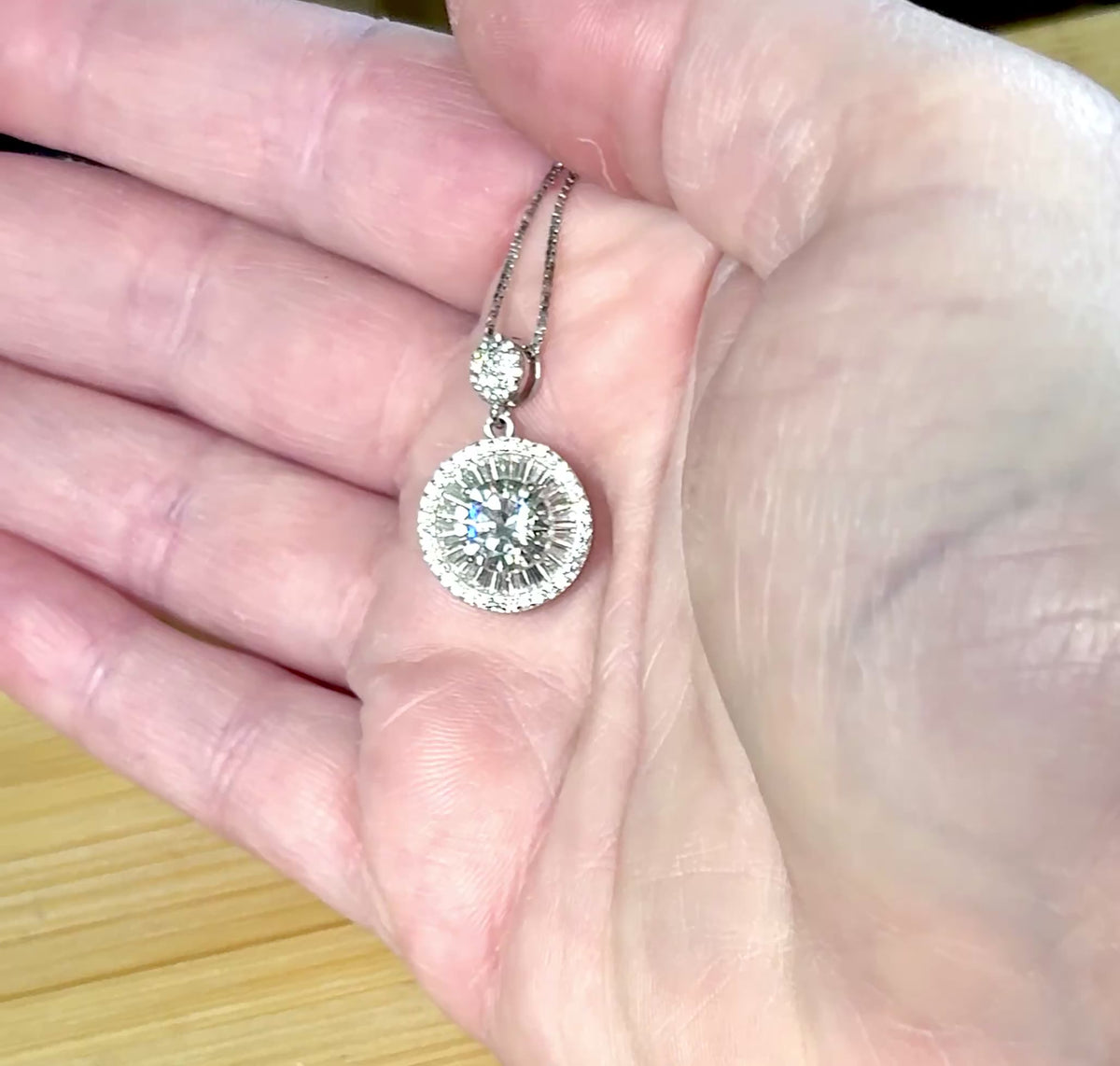Moissanite necklace. The certified 2ct Moissanite “Sunburst” necklace with a 61 gemstone pendant plus more in the bail! Radiantly beautiful!