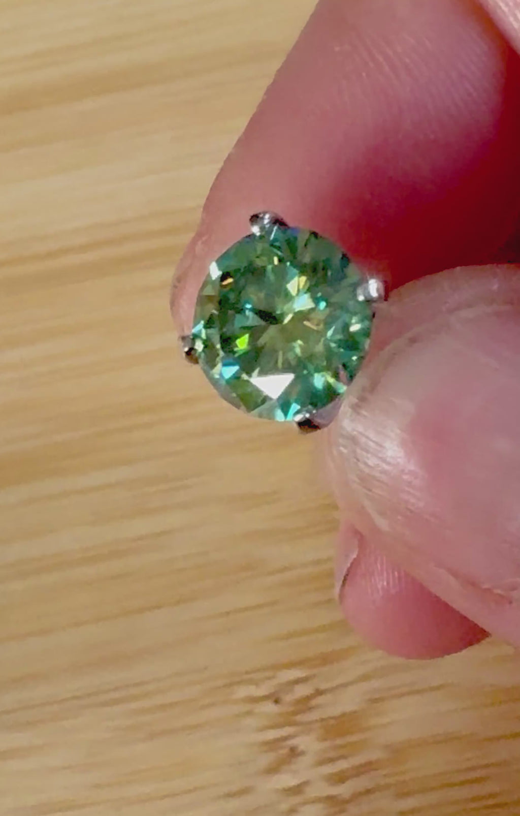 Moissanite studs. A 2cttw or 6cttw pair of cyan (greenish-blue) Moissanite studs. Double certified and rich in color, they are delicious!