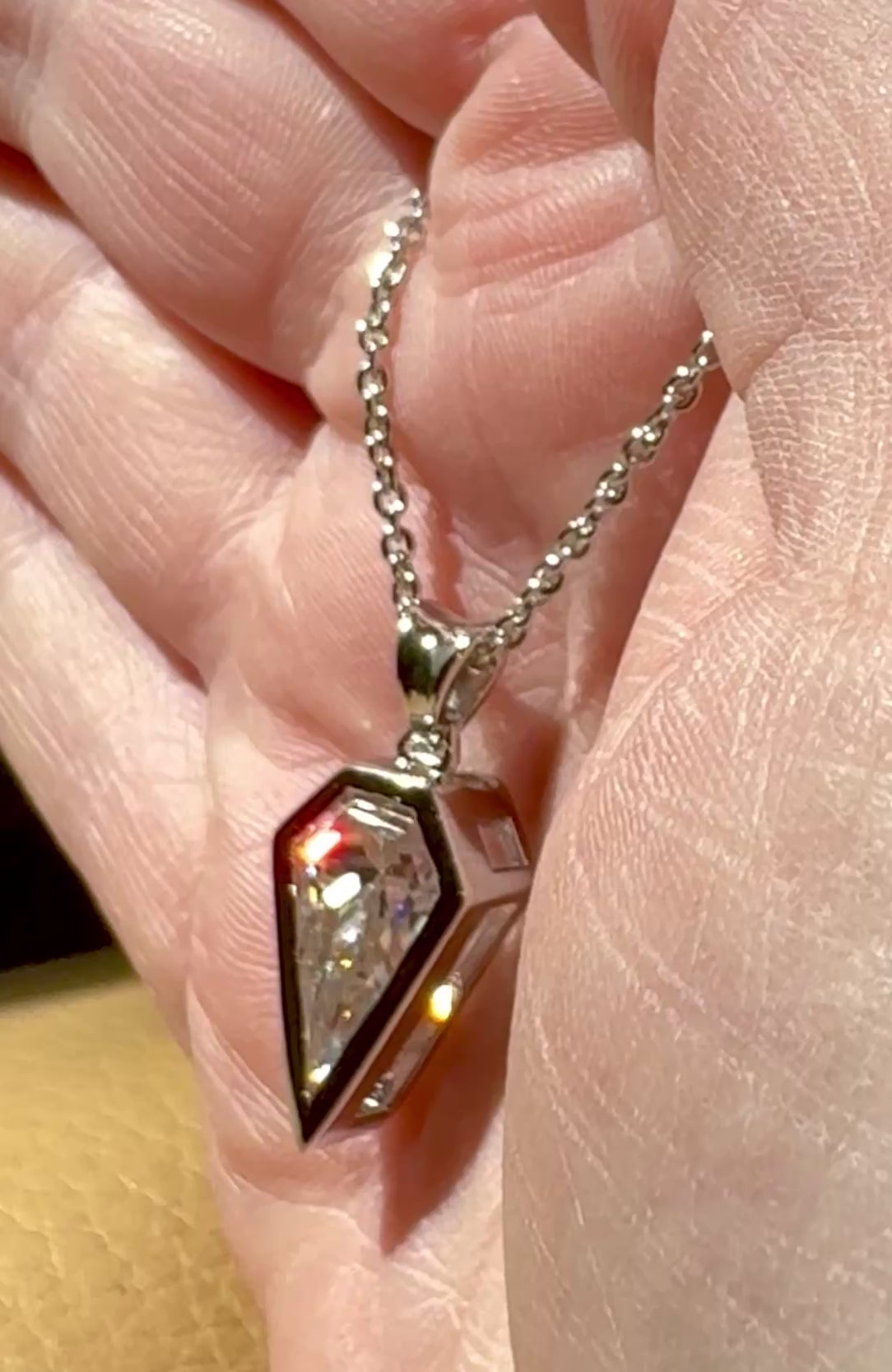 Moissanite necklace. “Flight!”, a kite-shaped, custom-cut 5ct Moissanite pendant! Hand-faceted by a master stone cutter and set in Argentium silver, it is suspended on a 20” sterling silver chain and is exclusive to Hand Knotted Jewelry!