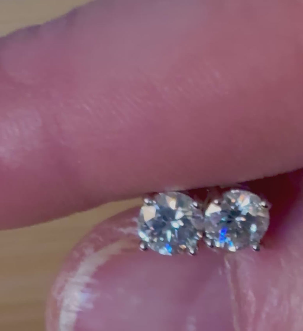 1cttw DOUBLE certified Moissanite studs with D-color and VVS1 clarity! Set in sterling silver bathed in 18k white gold, they’re a cut above!